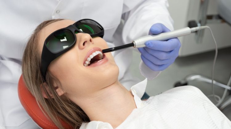Patient receiving laser dental treatment at Dental Nation in Las Vegas, NV
